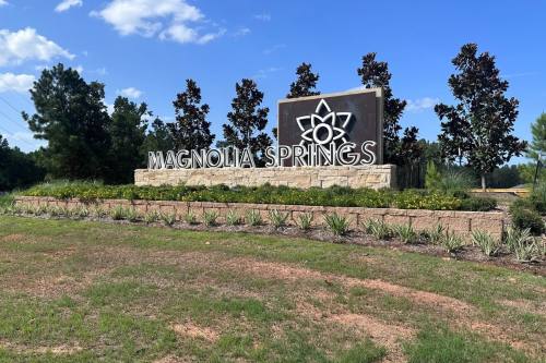 Wildflower Park, an outdoor destination inside Magnolia Springs, features a pickleball court, playground, walking trails and a community pavilion. (Lizzy Spangler/Community Impact)
