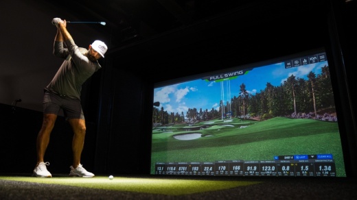 Golfer using the golf simulation equipment