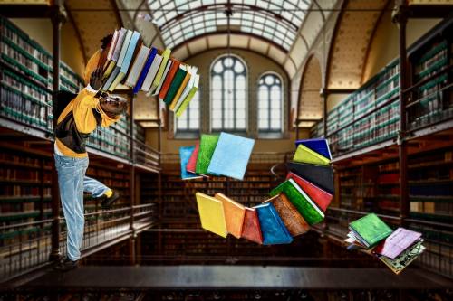photo with flying books in a library