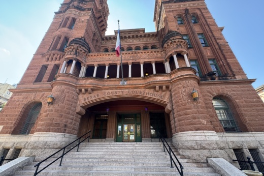 ground level view of a red brick courthouse