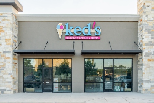 building with a sign for Ked's Ice Cream