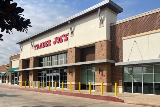 front entrance and sign for a trader joes store