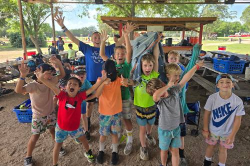 Camp Doublecreek Day Camp singalongs and counselor-led activities creating a safe, family-like summer experience for children.