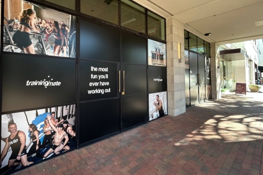 Exterior of a store featuring Training Mate window signage.