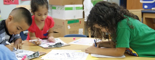 From left: Gavino Romero, Kimberly Leyva Aviles and Audrena Gaitan work at a coloring station in a San Marcos CISD pre-K classroom. The districtu2019s pre-K program is currently housed in Hernandez Elementary, but a dedicated pre-K campus is slated to open in the spring semester at 1225 Hwy. 123.