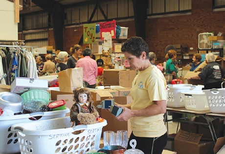Volunteers prepare donations in anticipation of this yearu2019s Settlement Home for Children Charity Garage and Estate Sale.