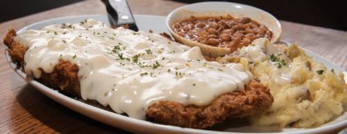 Chicken-fried steak ($11.99-$17.99) is served with mashed potatoes and beans.