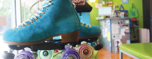 The window display at Medusa Skates rotates themes throughout the year, such as this display with vintage blue suede skates.