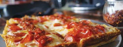  Via 313 Pizzeriau2019s Detroit-style pizza crust is baked in metal trays similar to those used on automotive assembly lines. The Detroiter ($12 for an 8-inch by 10-inch or $23 for a 10-inch by 14-inch) is topped with red sauce, pepperoni and cheese.
