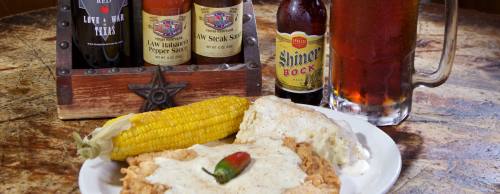 Love & War in Texas owner Tye Phelps (middle) created his concept to promote all things Texas, including its food, music and history. The Big Tex chicken-fried steak ($12.99) comes with two sides.n