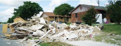Many San Marcos houses with flood damage have been gutted, but volunteers are still needed to help throughout the county.