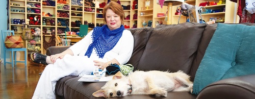 Owner Sheryl Means hosts weekly knitting groups with Maggie, Yarntopiau2019s resident rescue dog. 