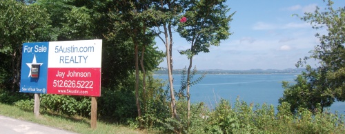 This waterfront property in the Marshall Ford area of western Travis County features expansive views of Lake Travis.