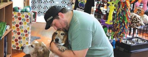 Woof co-owner Mark Hardy helped turn specialty cooking for his dogs into a business.