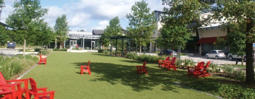 The center of Creekside Village Green features a similar concept to Market Street, with a tree-lined park, a water feature and chairs available in the park area.