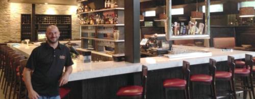 General Manager Dave Dobbins helped open Crisp on April 17 on Research Forest Drive.n