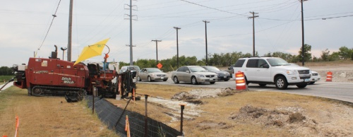 The project is a major overhaul of FM 685 in Hutto between SH 130 and Hwy. 79. The road will be widened from two lanes to four lanes. Medians and turn lanes will be added, and two new bridges 12 feet higher than the current bridges will be built. The work is intended to improve traffic flow and safety. Crews are working on relocating drainage systems to allow for the road and bridge expansions as of August.
