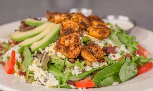 A classic dish at Rockfish Seafood &amp; Grill is the blackened shrimp cobb salad.
