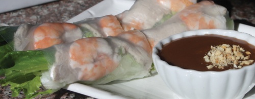 Appetizers include shrimp and pork salad rolls served with peanut sauce ($3.95).