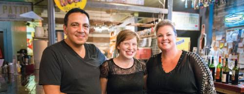 Roots co-owners Kamil (left) and Jeana Aliani (right) purchased the business in January, and Manager Madison Simmons (center) has worked with the Roots for nearly five years.