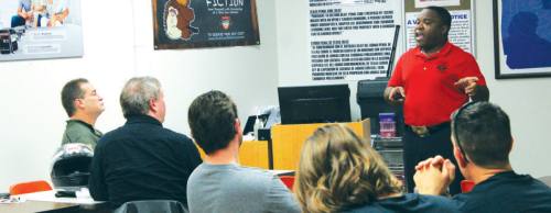 Michael Cargill, owner and instructor at Central Texas Gun Works, hosts a concealed handgun license training class in South Austin.