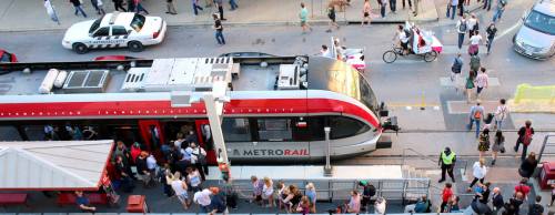 Passengers enter a MetroRail train March 13 during the 2016 South by Southwest Conferences & Festivals. The station is located outside the Austin Convention Center.