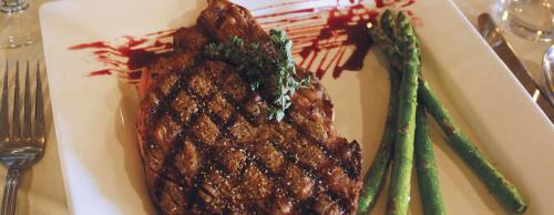 The Cote De Boeuf ($38.95) features a bone-in ribeye served with asparagus spears.