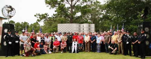 Past and present military members gathered for a group photo in front on the Friendswood Veterans Memorial on May 30.