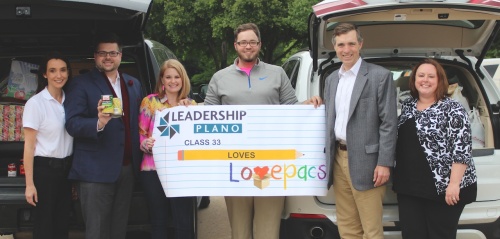 Leadership Plano project co-chairs are joined by Van Taylor, R-Plano (second from right) load donations in to two vehicles to go back to Love Pacs headquarters.