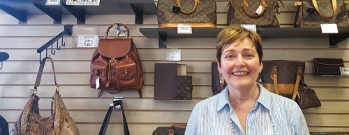 Closet Revival owner Cynthia Riley takes pride in her collection of Louis Vuitton handbags. 