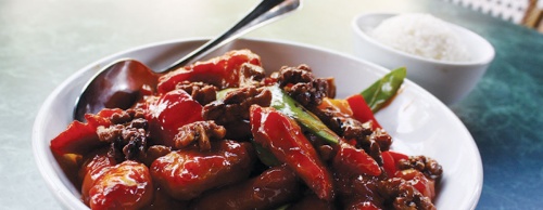 The glazed walnut chicken ($16) features chicken, walnuts, snow peas and red bell peppers. 