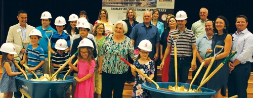 Shirley Brothers (center) stands with family members at the ground breaking ceremony June 2.