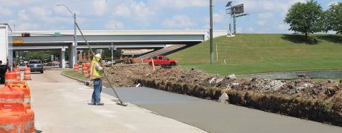 Work continues on an extra right-turn lane from westbound Fry Road onto the northbound lanes of the Grand Parkway in Katy.