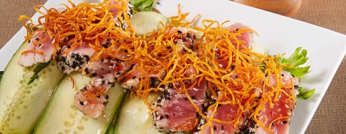 The seared sesame tuna carpaccio ($18) is served with jicamca-lime coleslaw.