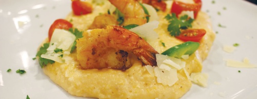 Grilled jumbo shrimp with smoked Gouda grits ($12) is a local favorite at The Omega Grill.