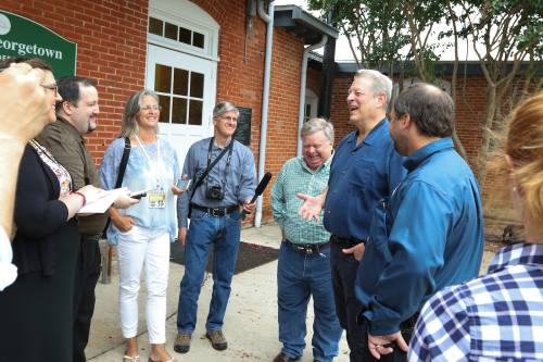 Former Vice President Al Gore (second from right) discusses the Georgetown Utility  System's move to a 100 percent renewable energy during an Aug. 15 visit to Georgetown.