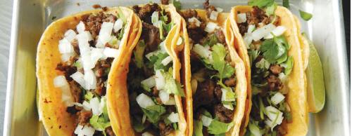 Street tacos ($9.75) are served in fresh corn tortillas with carne asada, cilantro, diced onions and lime wedges.