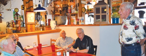 Owner Tom Ott (right) often sings for customers who eat at Humble City Cafe.
