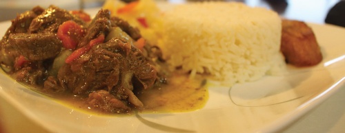 The curried goat plate ($11.99 for small) is made with curry paste and served with white rice.
