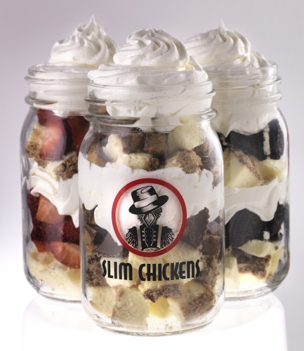 In addition to chicken tenders and other entrees, Slim Chickens also serves Mason jar desserts like cheesecake with fresh fruit.