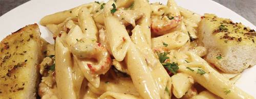 Cantina pasta served with garlic bread is one of Cajun Cantinau2019s more popular menu items ($9.95).
