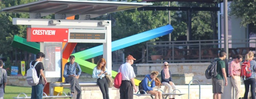 Passengers await buses at the Crestview Capital Metro transit station on Sept. 14.