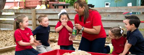 Instructor Marisell Torres leads outdoor activities with children at the Royal Lane location.