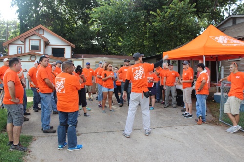 The Home Depot store manager Josh Mayou splits the volunteers into teams. 