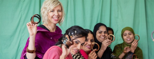 Raven + Lily founder Kirsten Dickerson (left) visits with women artisans in India.