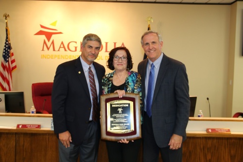 Magnolia ISD Superintendent Todd Stephens (left) and Board President Gary Blizzard (right) recognize out-going member Deborah Rose Miller (center) for her eight years of service with the school board.