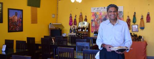 Owner Jay Patel prepares dishes to order and invites customers to join him in his kitchen.
