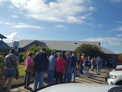 Voters lined up for early voting Oct. 26 at the Travis County Tax Office in Pflugerville.