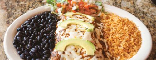 Enchiladas Diablo ($11.99) comes with two chicken or beef fajita enchiladas and sour cream rolled in flour tortillas and topped with a spicy smoked chipotle sauce and avocado slices.