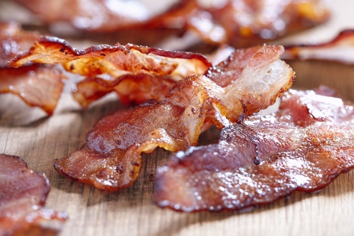 Crispy Cooked Bacon On Wooden Table, Close Up